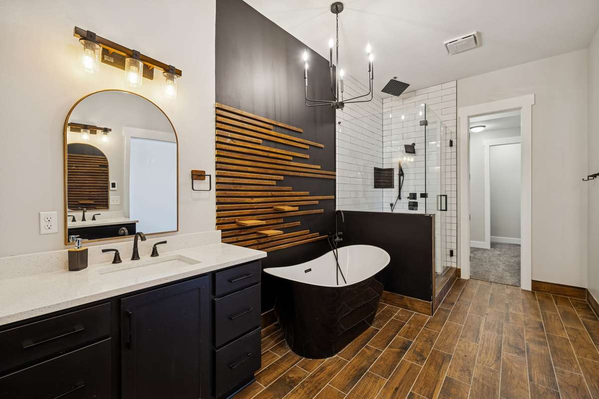 Another view of the bathroom with garden tub & modern chandelier. 763 Thompson Creek Rd. Shelbyville, TN 37160