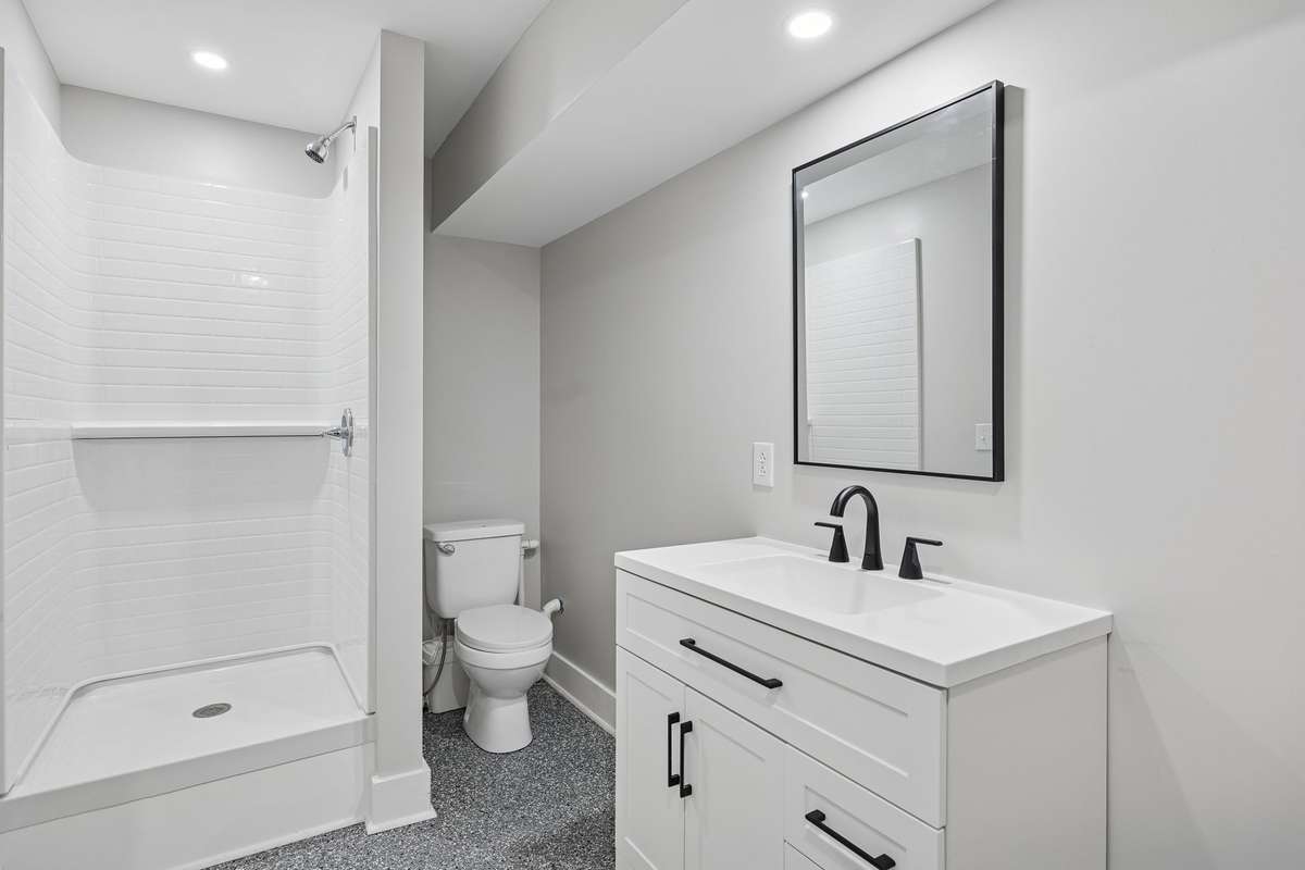 Guest bath with single vanity, recessed lighting, & walk in shower. 763 Thompson Creek Rd. Shelbyville, TN 37160
