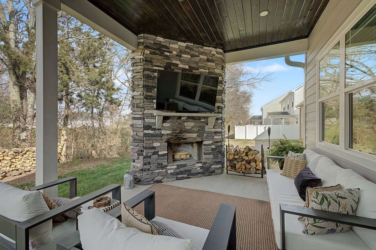 Wow! Step outside & enjoy this Gorgeous Outdoor Entertaining Area with Stacked Stone Woodburning Fireplace with Stained Wood Ceiling, Recessed Lighting and Ceiling Fan. Extended Back Patio has additional space for Large Dining Table & Grilling Area.