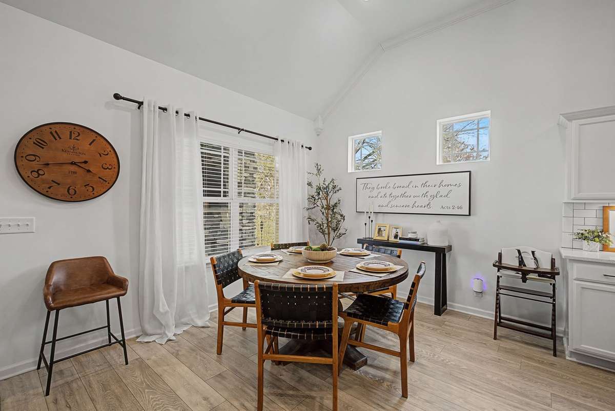 Dining Area adjacent to Kitchen has ample room for table and windows for natural light.