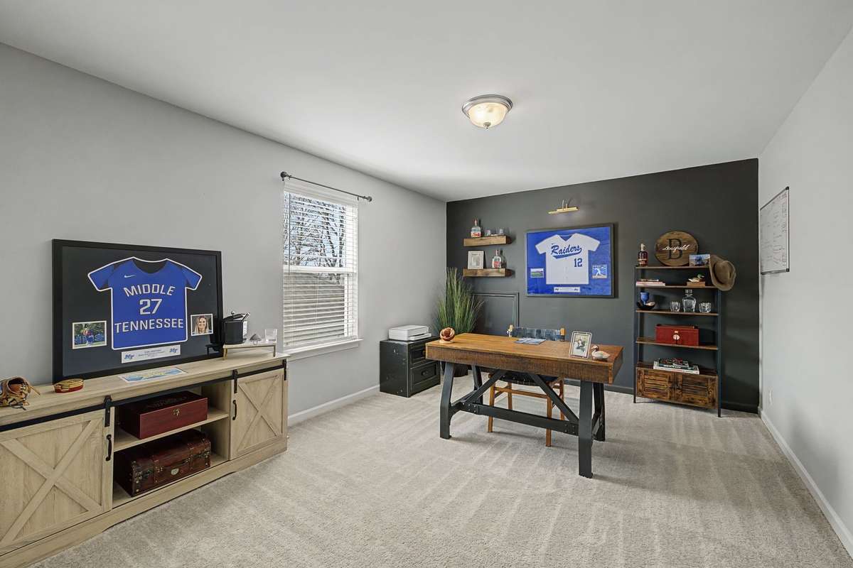 Bedroom #4 located upstairs. Currently used as an Office. Accent Wall and large closet.