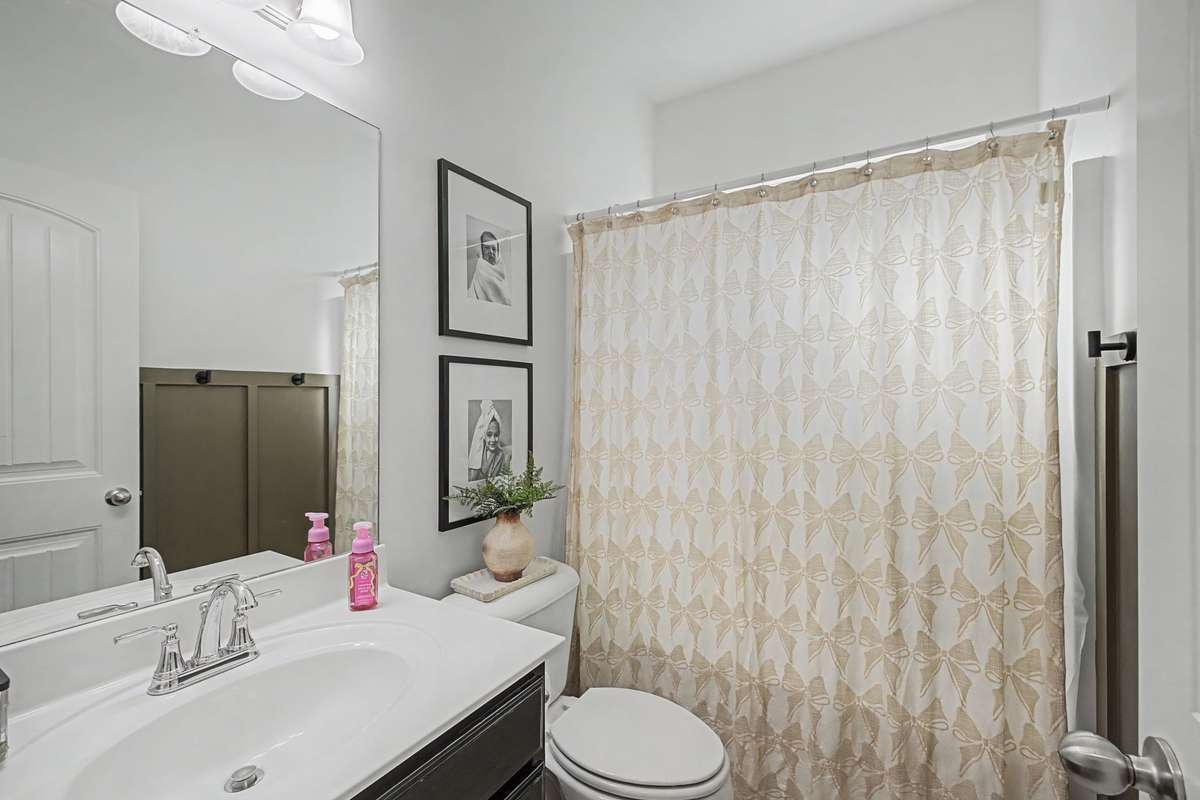 Full Bath #2 Downstairs located conveniently Between Bedroom #2 & Bedroom #3 and near the Great Room