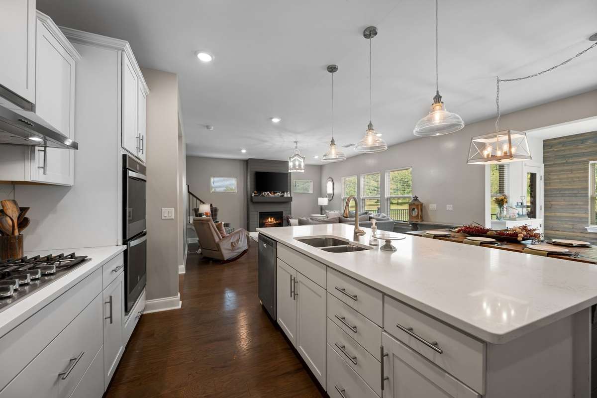 This kitchen boasts a gas cooktop, double ovens, and excellent pantry space for all your storage needs.