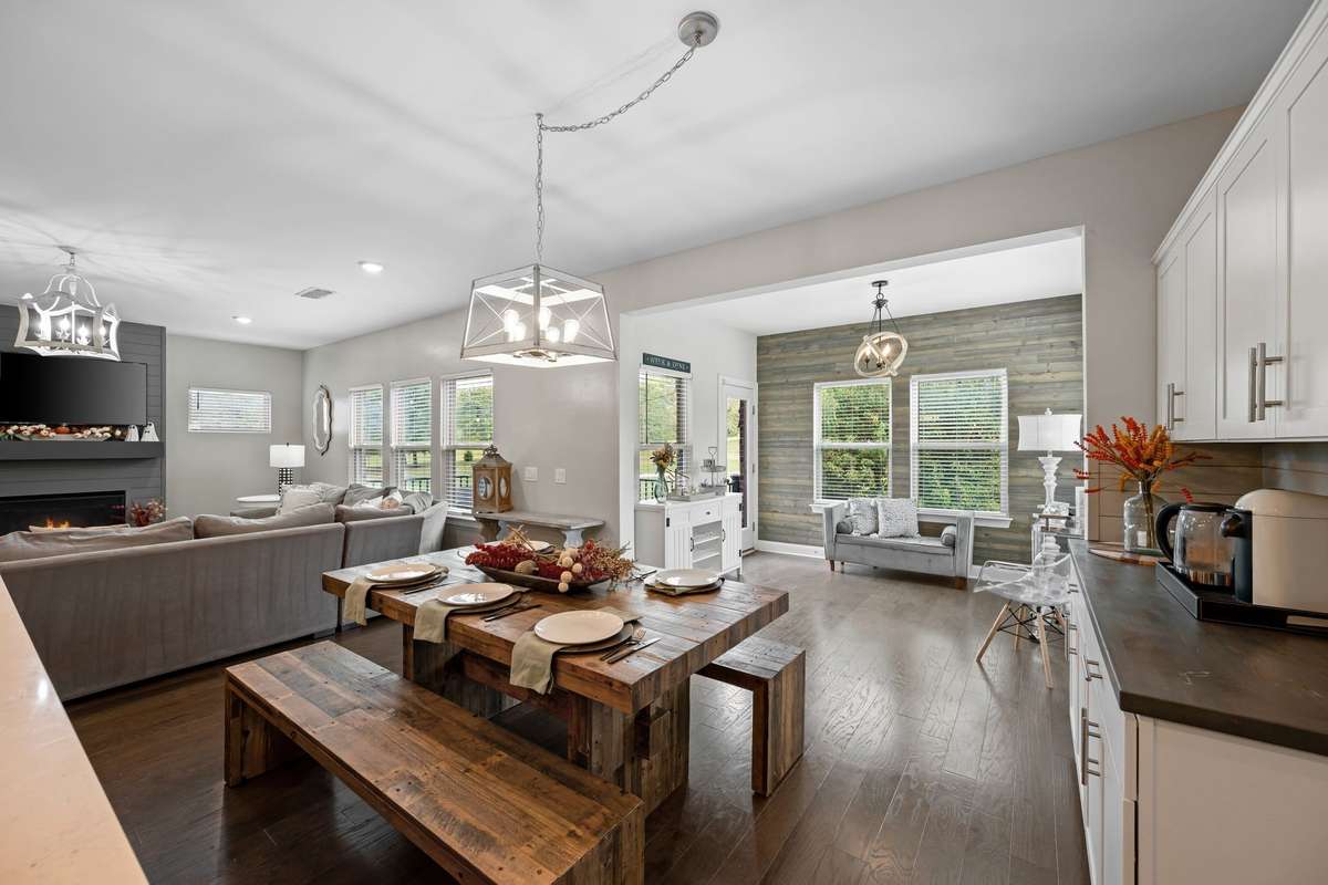 The dining area offers a built-in beverage center and ample storage, ideal for hosting and everyday convenience.