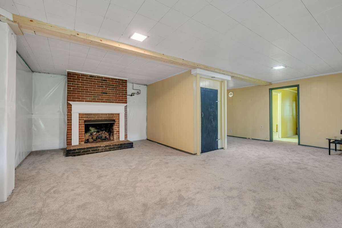 Basement Family Room with Storage Closet and Fireplace. 2 Unfinished Walls with AFS moisture Barrier.