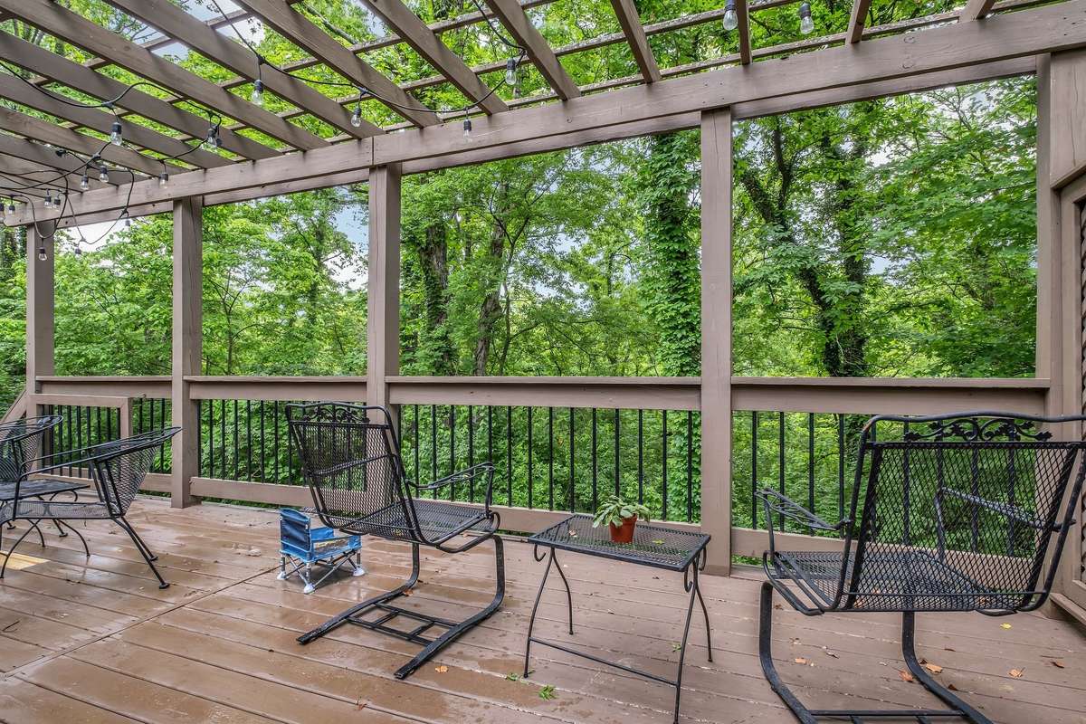 Great view of woods or you can see down the hill to a clearing by a creek at the back of the property.