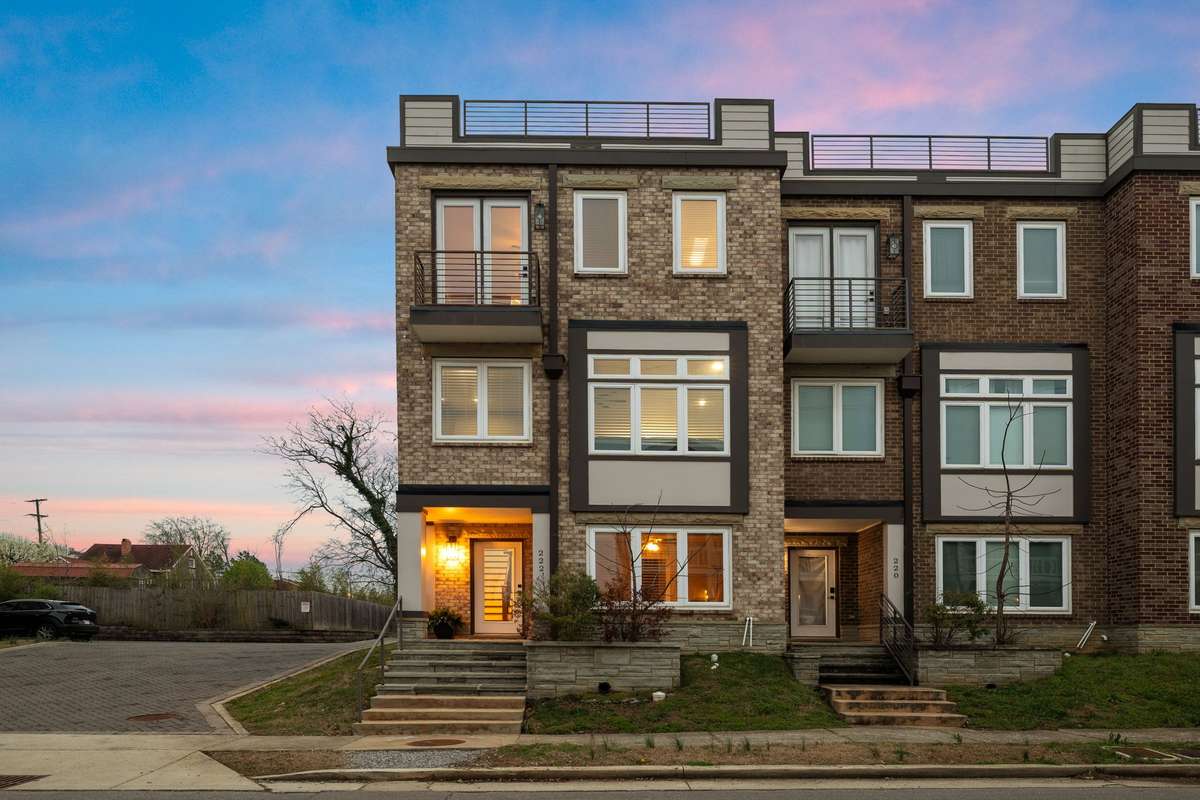 Modern townhome in the heart of Old Hickory featuring striking brick architecture, private balconies, and rooftop terrace potential. Stylish exterior design and inviting entry create a standout presence in this lakeside community.