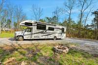RV Hook up with fire ring, 50 amp plug in and septic dumping station,