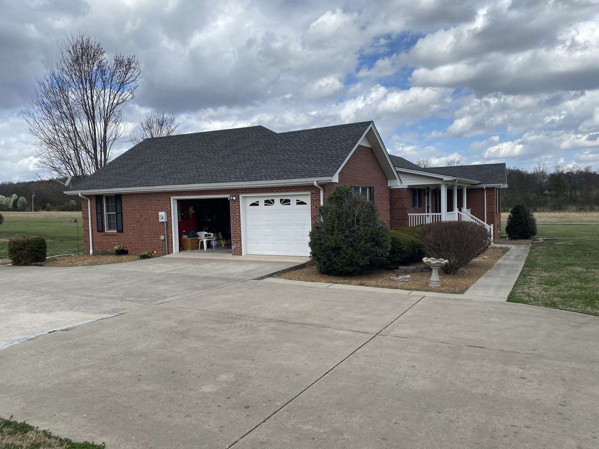 True 2 car garage that is currently being used as family game room.