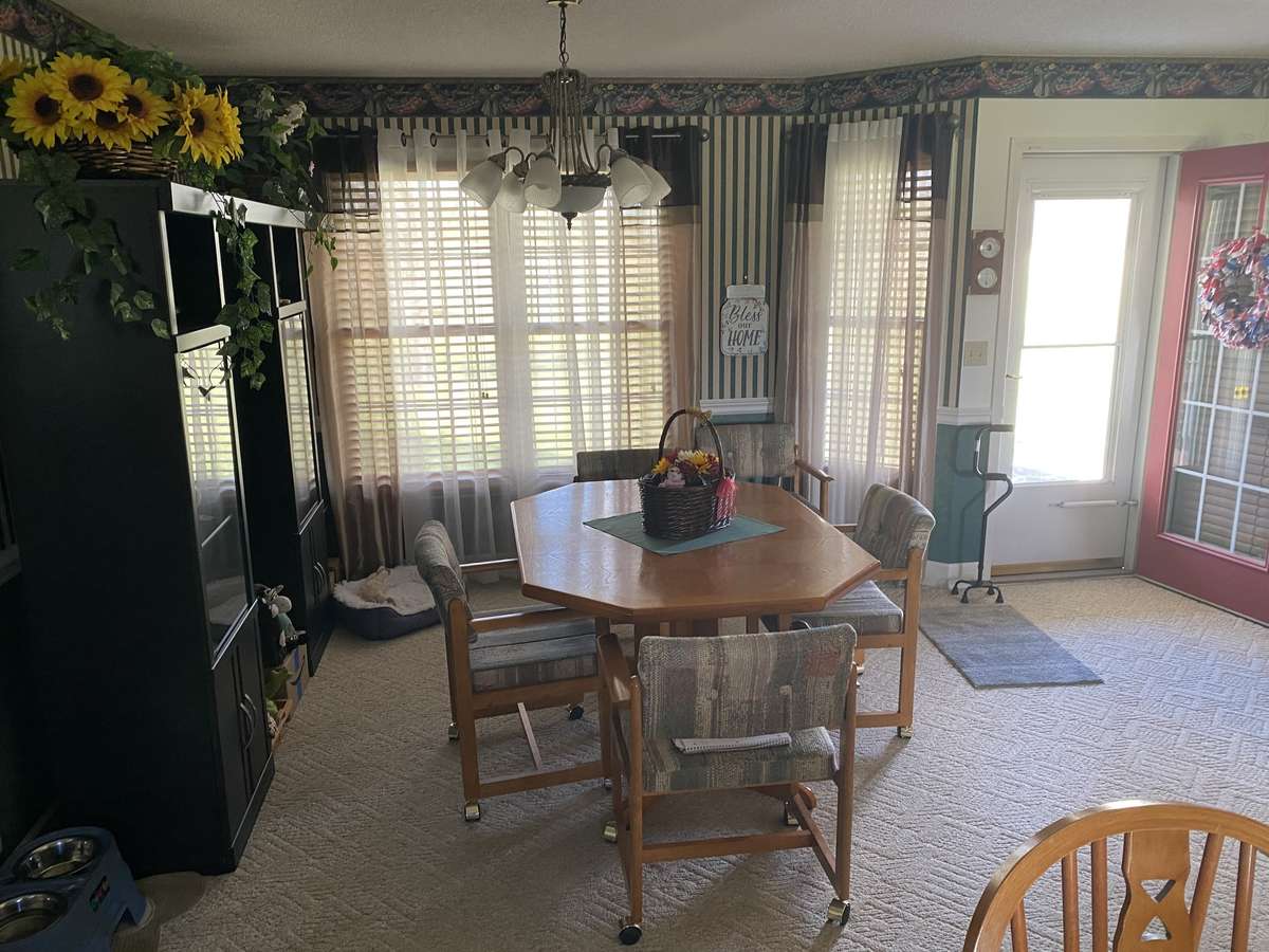 Dining just off of kitchen with large windows