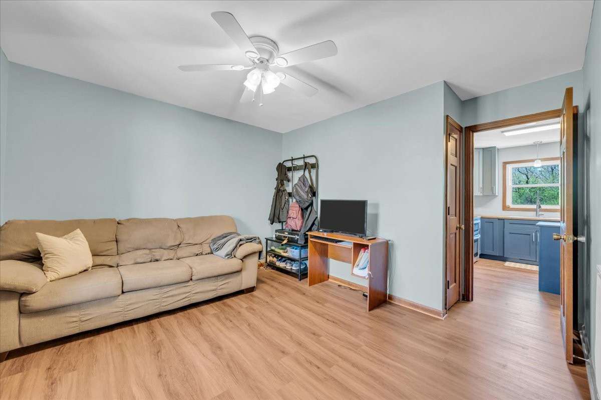 Versatile downstairs flex space ideal for a 5th bedroom, media room, office, homeschool area, or hobby room.