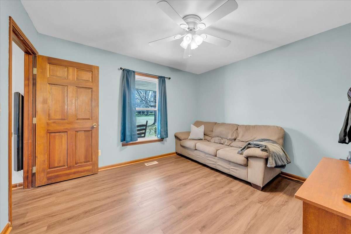 Versatile downstairs flex space ideal for a 5th bedroom, media room, office, homeschool area, or hobby room.