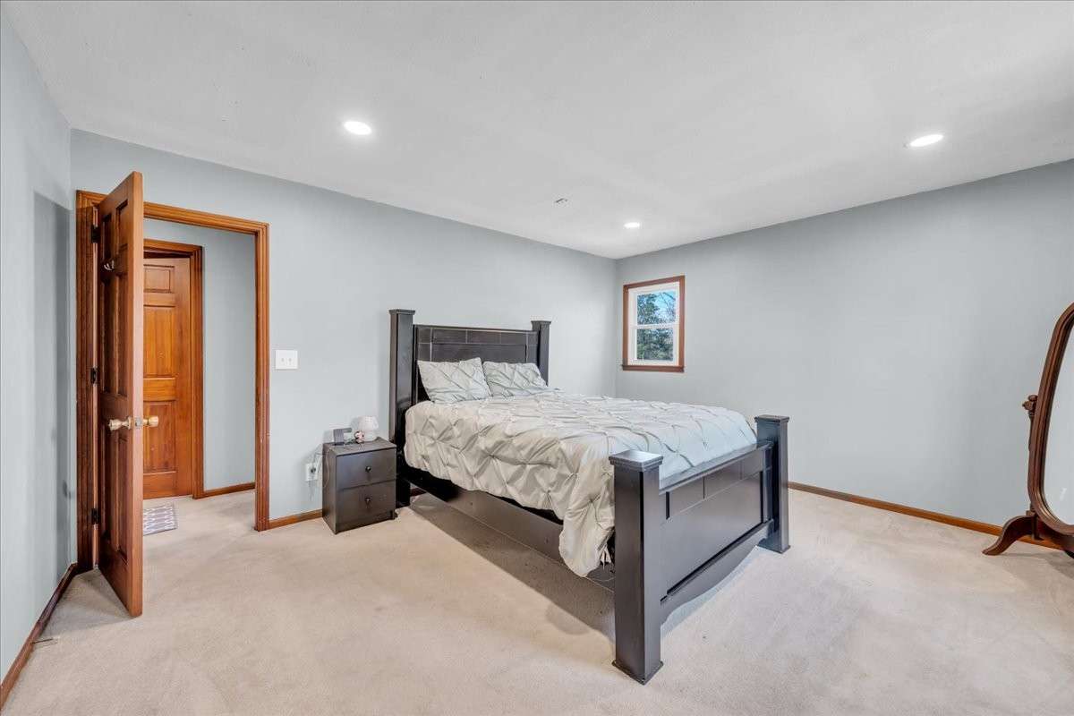 Spacious primary bedroom offering comfort and privacy with ample room for furnishings.