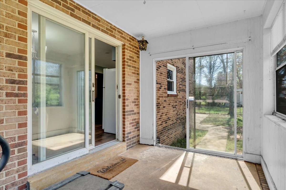 Enclosed back patio offering additional versatile space, which is perfect for entertaining, a home gym, or a future greenhouse.