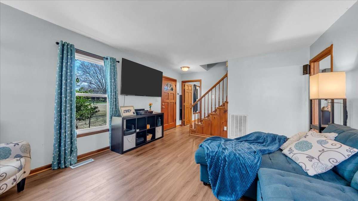 Living room features built in surround sound and a wood burning fireplace
