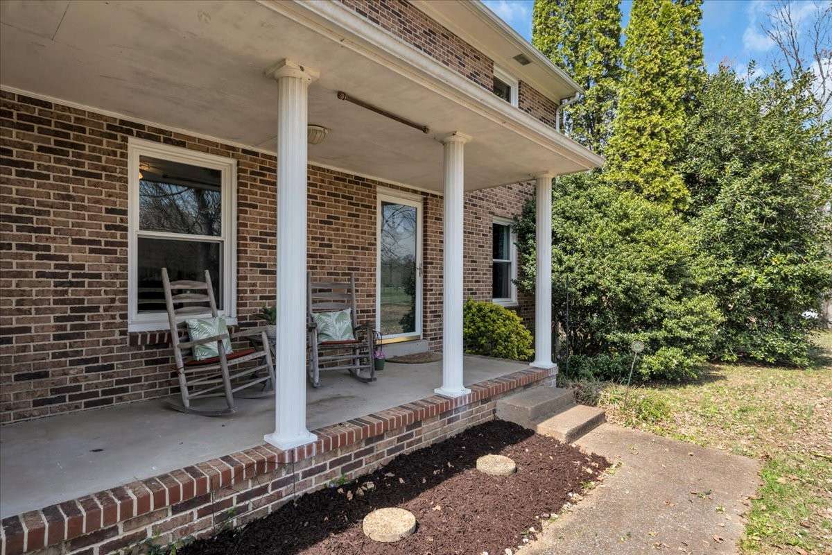 Charming covered front porch ideal for enjoying peaceful mornings and quiet evenings.