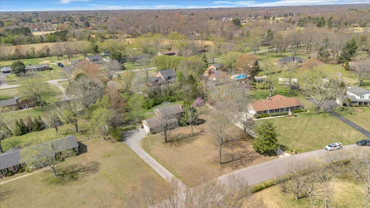 Welcome to 203 Twelve Oaks Rd in Tara Estates! This 4 bedroom, 2 bath home with a flexible bonus room sits on 0.89 acres and is just minutes from downtown Tullahoma, Normandy Lake, and Tims Ford Lake and Lakewood Country Club