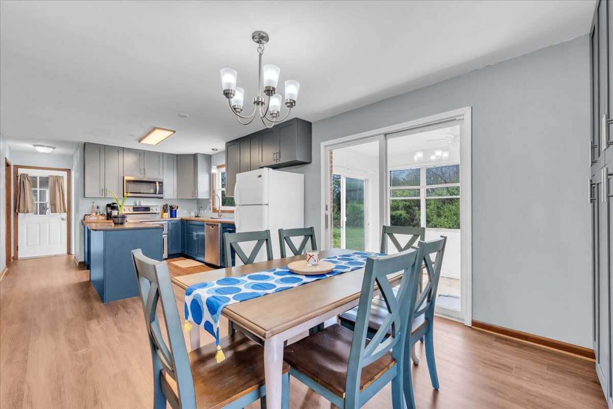 Bright dine-in kitchen space with ample room for gatherings, enhanced by custom cabinetry and functional layout.