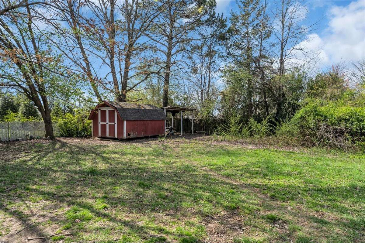 Two storage sheds convey with the property, providing additional space for tools, equipment, or hobbies.