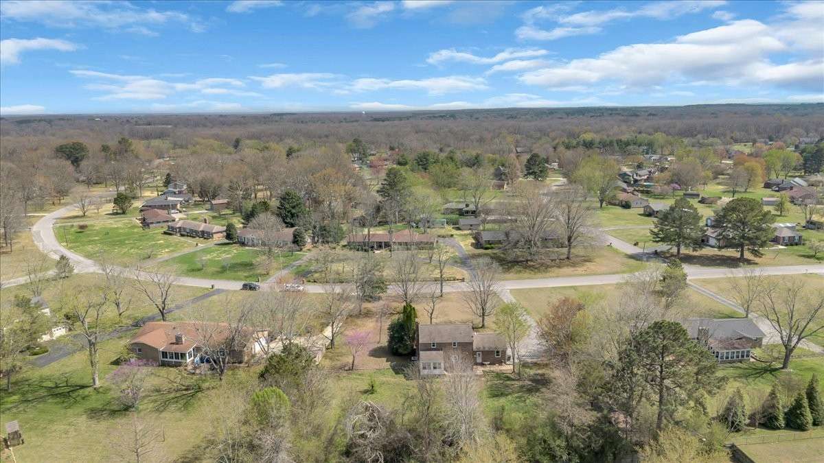 Welcome to 203 Twelve Oaks Rd in Tara Estates! This 4 bedroom, 2 bath home with a flexible bonus room sits on 0.89 acres and is just minutes from downtown Tullahoma, Normandy Lake, and Tims Ford Lake and Lakewood Country Club