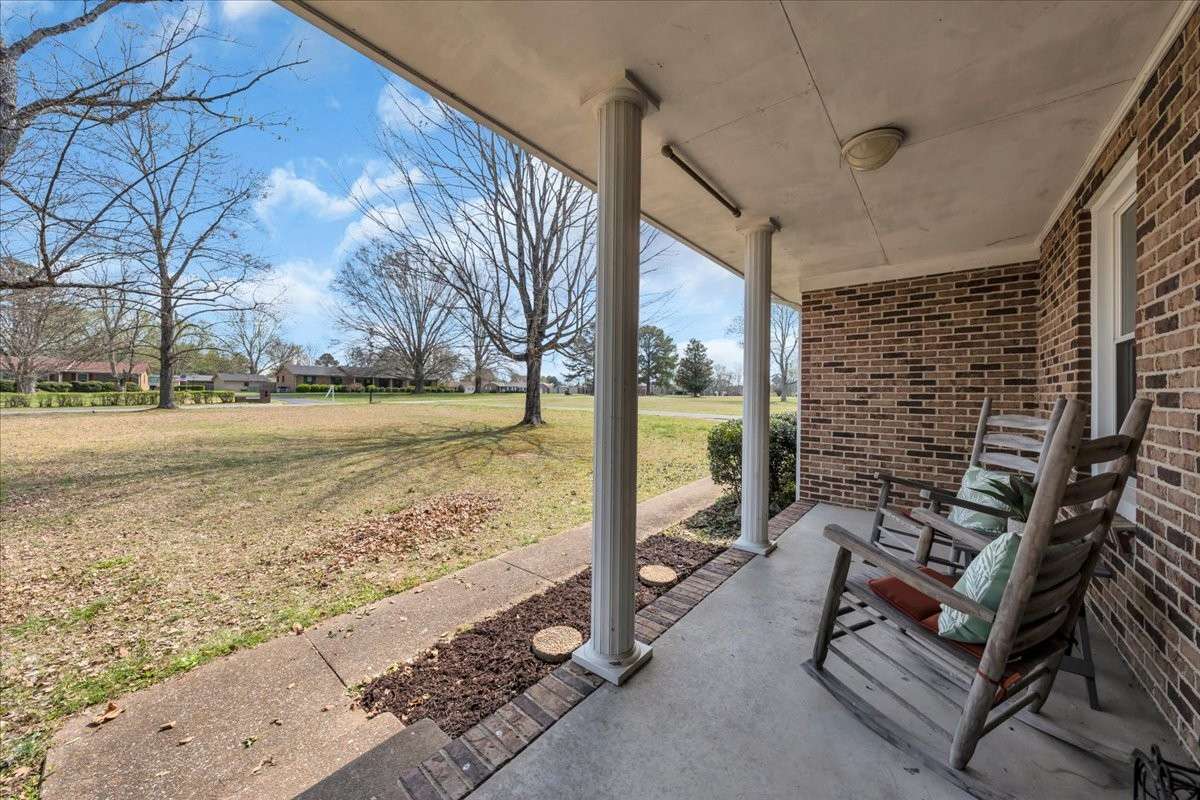 Charming covered front porch ideal for enjoying peaceful mornings and quiet evenings.