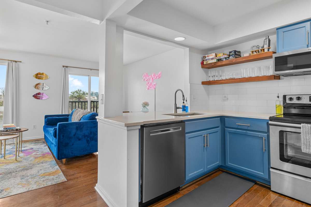 The area above the sink has been opened up to overlook the living/dining area to keep the conversation flowing!