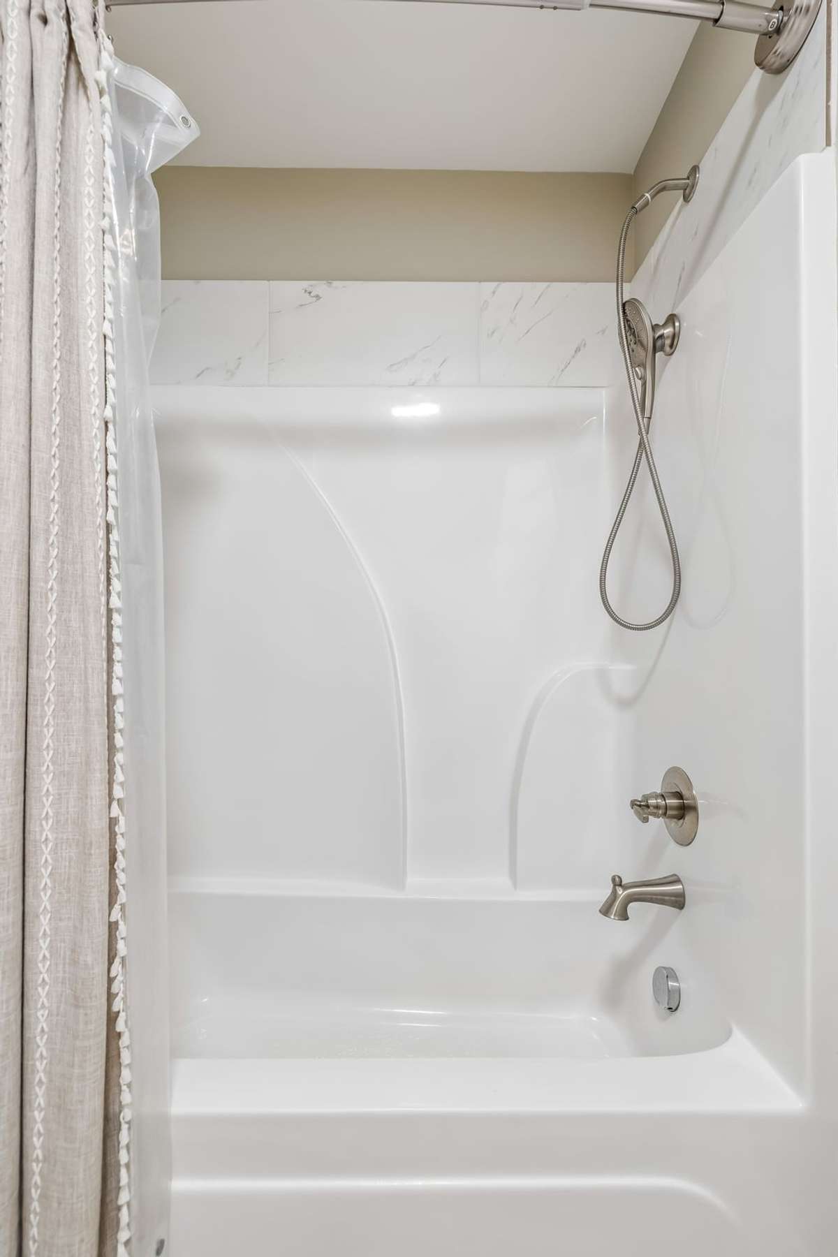 SHOWER/TUB COMBO IN THE NEXT PART OF THIS BATHROOM WITH A DOOR.