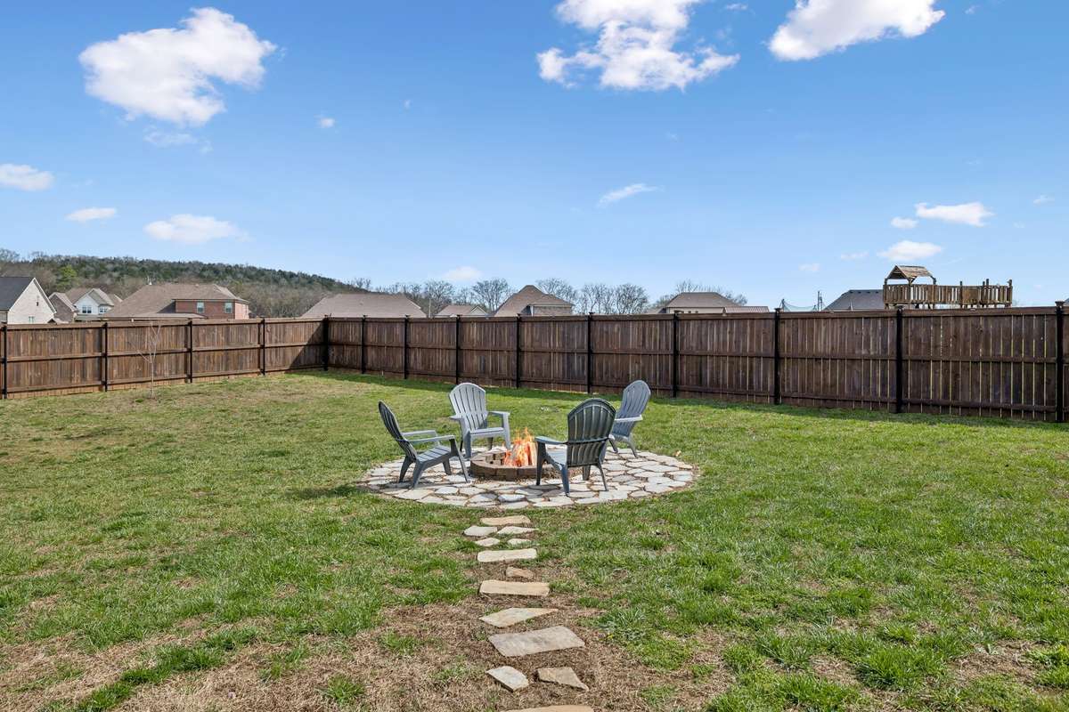 THERE IS A FLAGSTONE ROCK PATH TO A FIRE PIT FOR THOSE SMORES NIGHTS, SITTING OUT GRILLING & CHILLING-THERE IS ALSO A GAS LINE TO HOOK UP YOUR GRILL IN THE BACK!