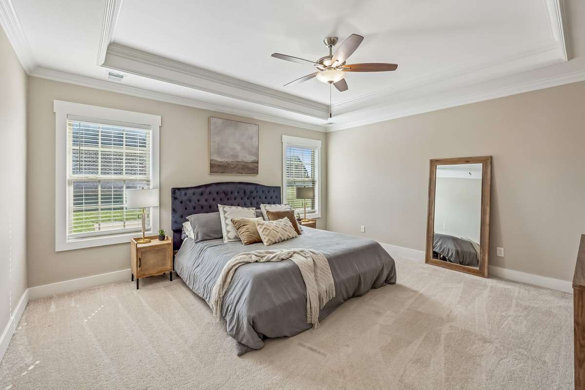 THE OWNER'S SUITE IS SWEET WITH TREY CEILING, TRIMMED WINDOWS, OVERSIZED TO FIT A WHOLE KING BEDROOM SUITE AND STILL HAVE EXTRA ROOM. WAIT TO SEE THE BATH!