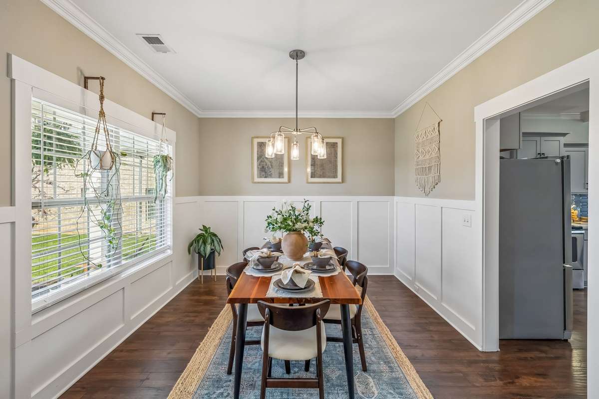 UPON ENTRY, THE FORMAL DINING ROOM WILL IMPRESS YOUR GUESTS WITH CROWN MOLDING AND WAINSCOTTING TRIM!