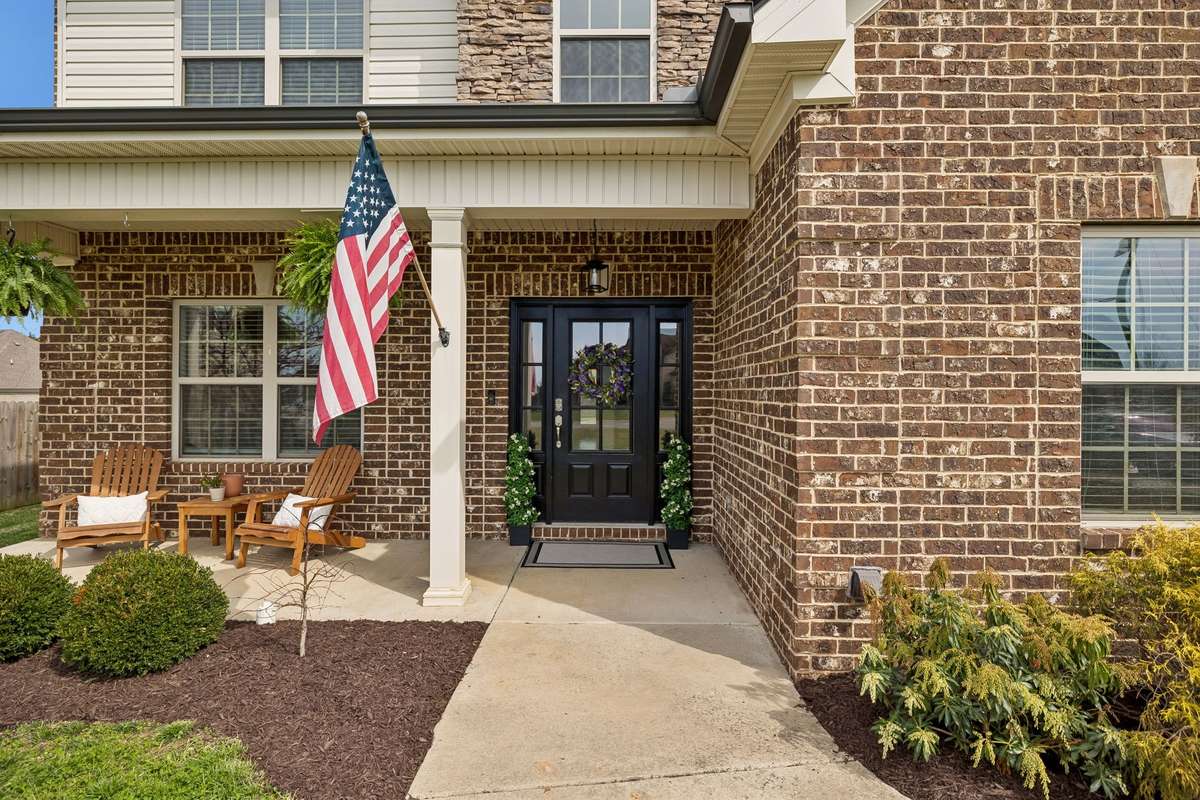 THIS IS SUCH AN INVITING ENTRY WITH THE BIG COVERED PORCH TO ENJOY COFFEE IN THE MORNING.