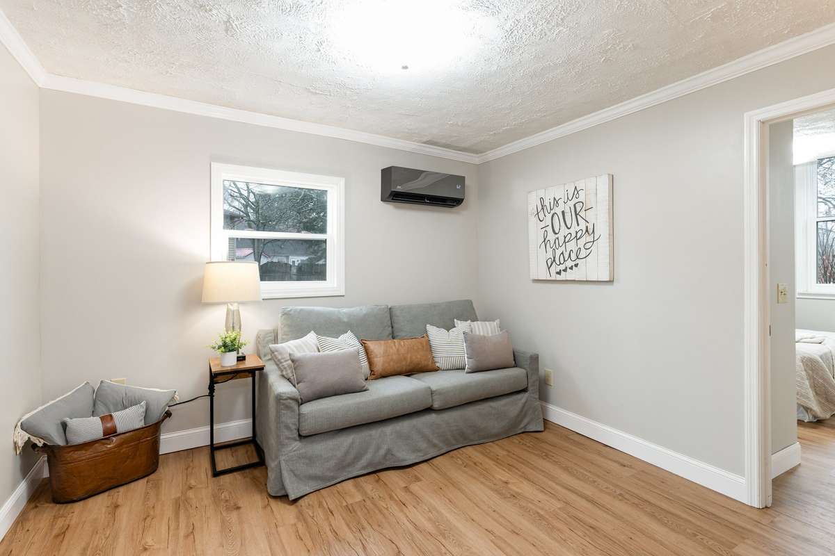 The secondary living room within the mother-in-law suite offers a comfortable and private retreat, perfect for multigenerational living or extended stay guests.