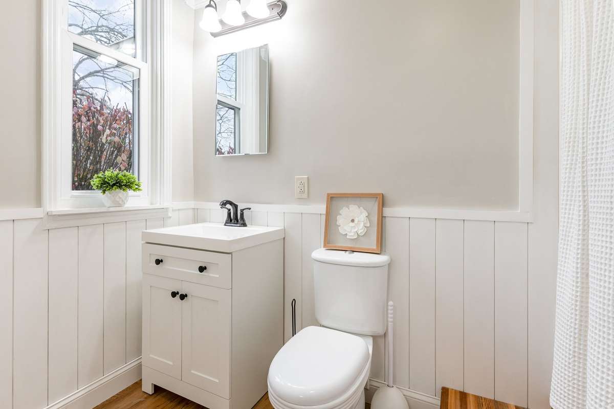 Full Bath #3 located in the Mother-in-law Suite features a quiet, tucked away setting with neutral finishes and ample natural light.
