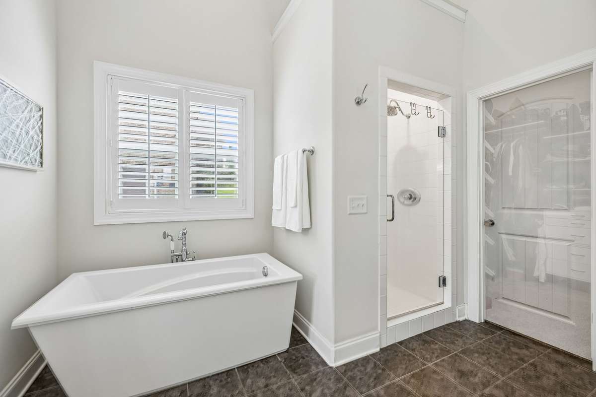 Primary closet is a walk in with closet system