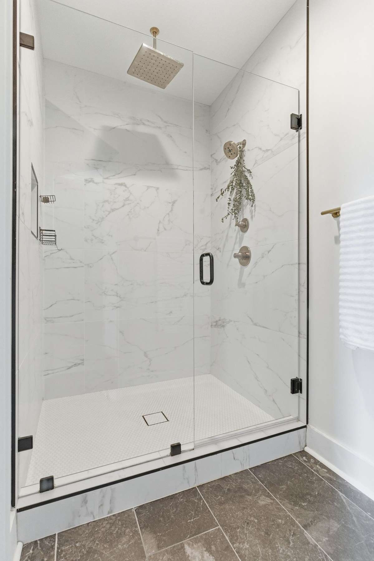 Enjoy a walk-in shower designed with added privacy for a truly relaxing experience.