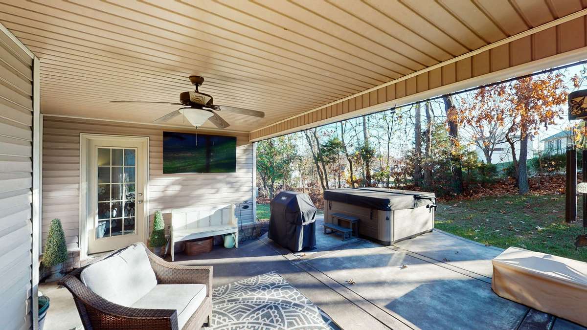The Back covered Patio. The entrance to the separate room that can be used as an office, Studio or craft room.