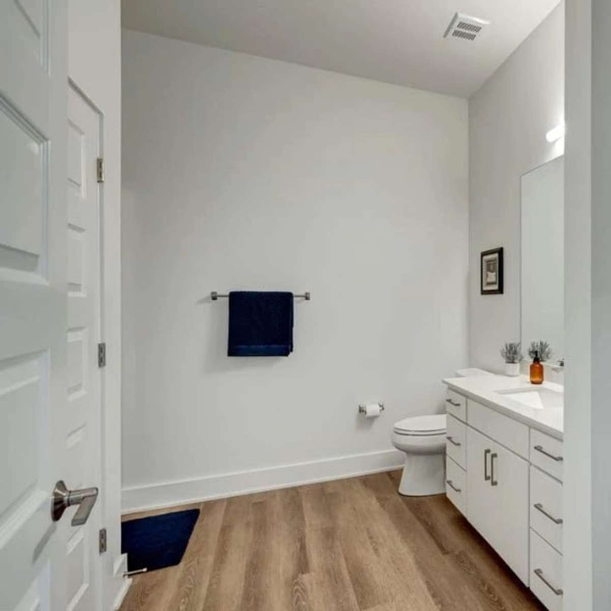 This bathroom has plenty of space!  The stackable LG washer and dryer are on the left.  There is plenty of space to do any ironing you may have.