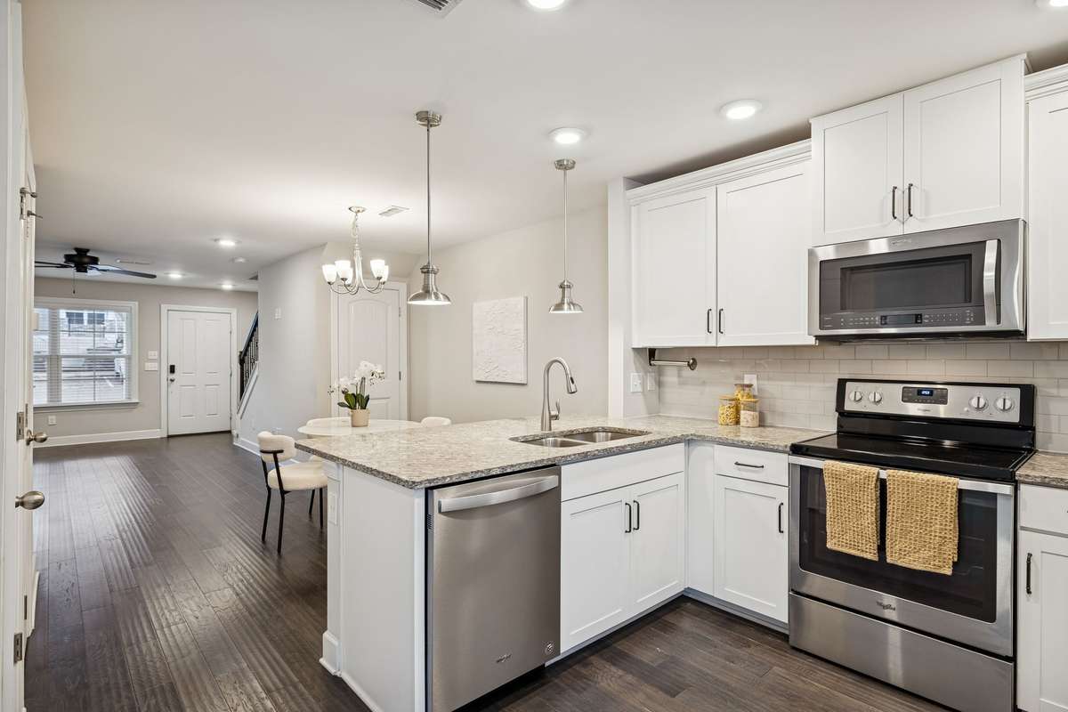 Kitchen perspective highlighting the centrally located pantry and the seamless transition into the dining and living spaces—ideal for everyday functionality.