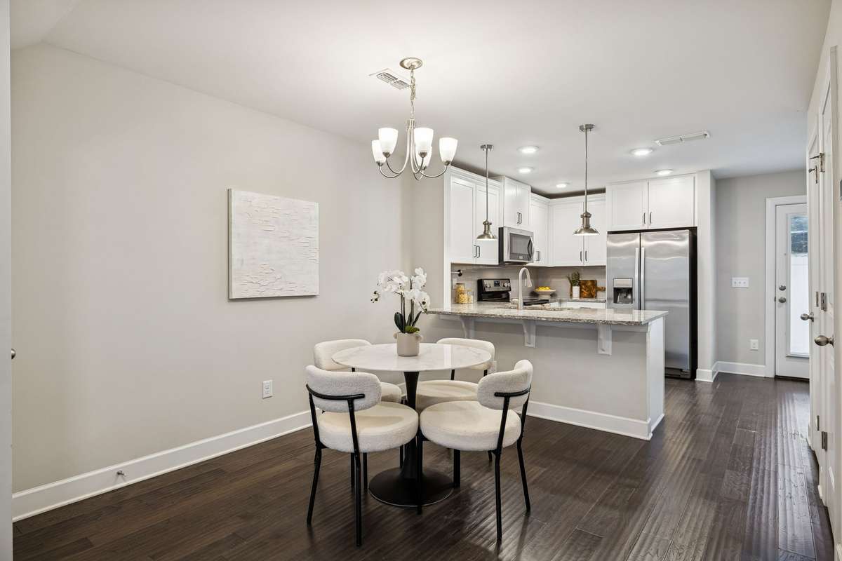 Thoughtfully designed main level with a seamless connection between the living, dining, and kitchen spaces, creating a bright and cohesive layout