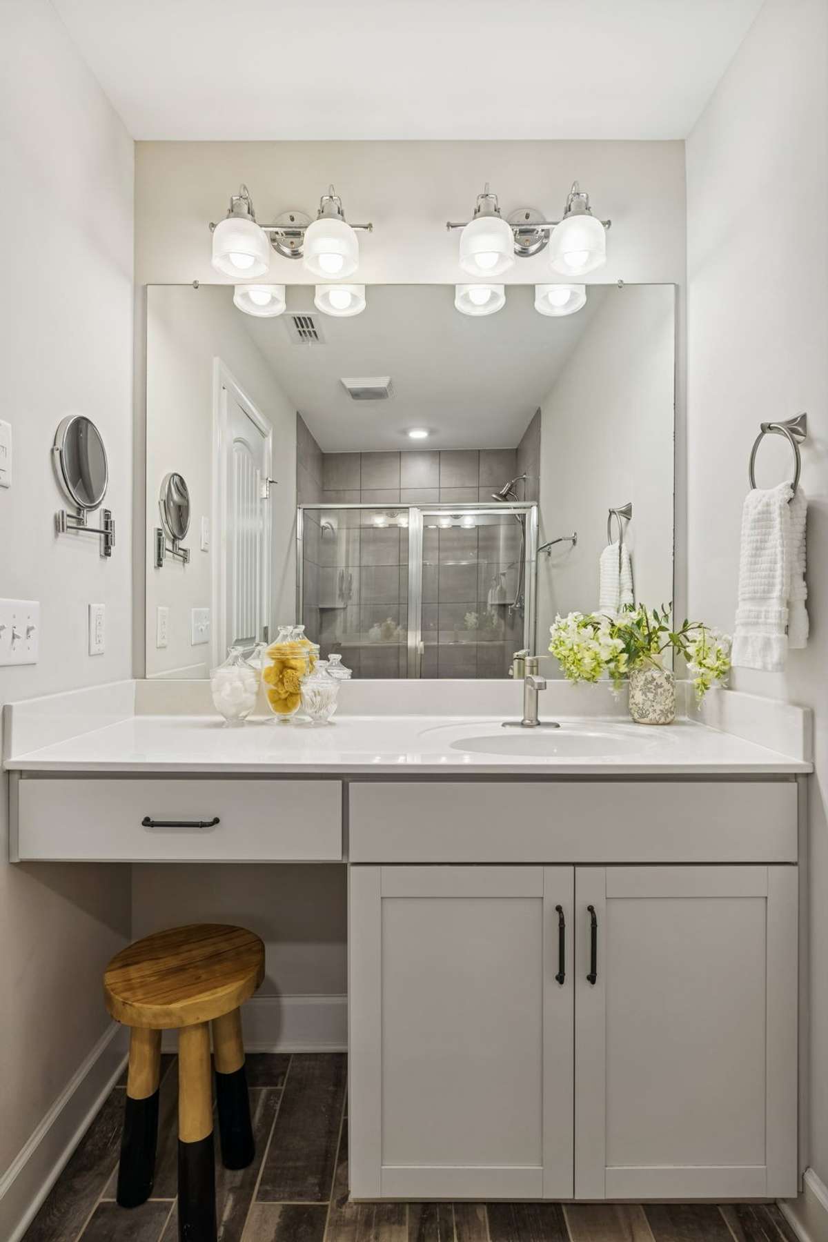 Primary bathroom vanity with a convenient getting-ready area and generous counter space.
