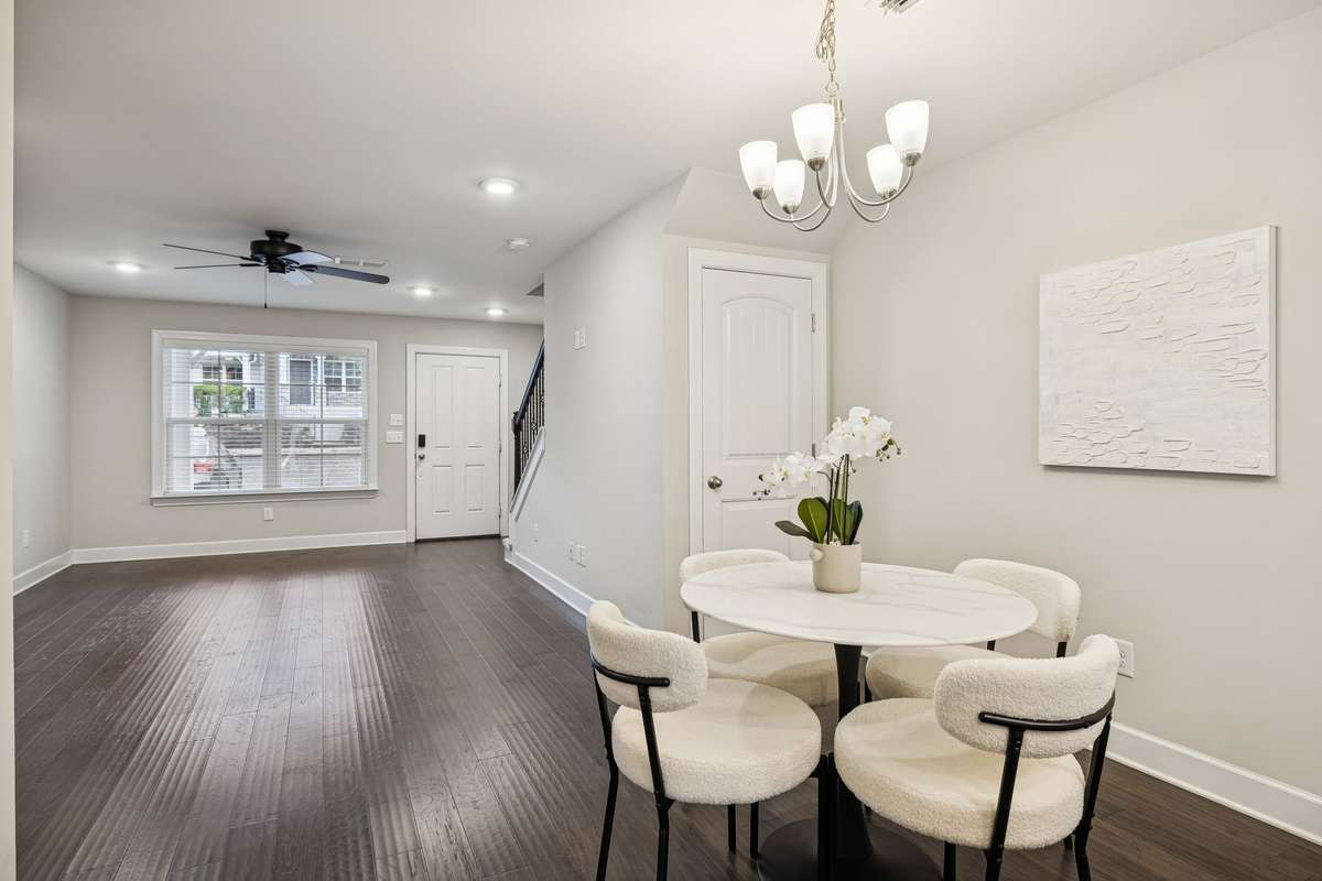 Spacious dining area positioned between the kitchen and living room, offering a natural gathering space within the home’s open layout.