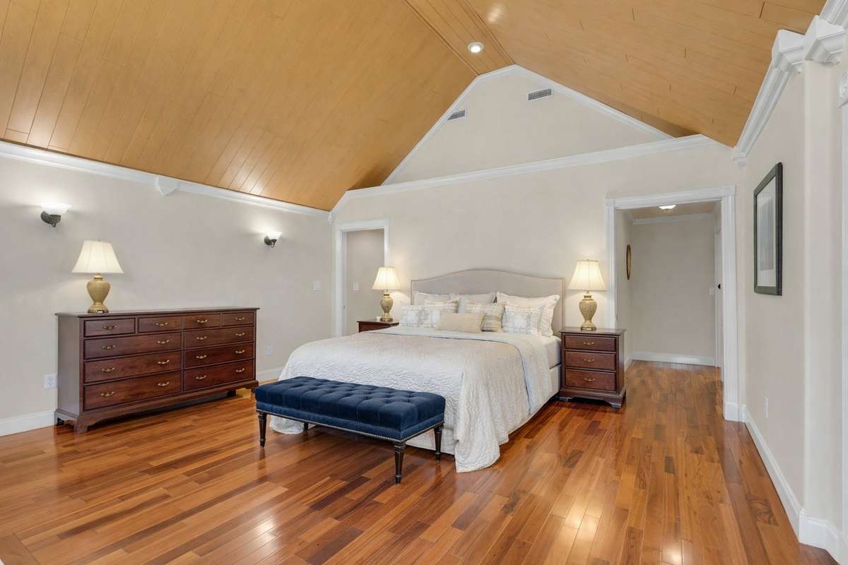 Owner's Suite with Brazilian tiger wood floors, spa-like bath, and a wonderful view of the lake