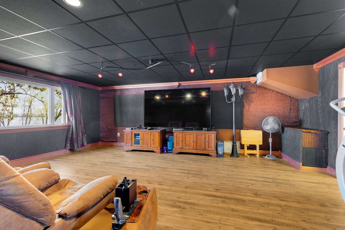 Theater room with acoustic tiles on walls and ceilings. This would also be ideal for a sound engineer or musician.