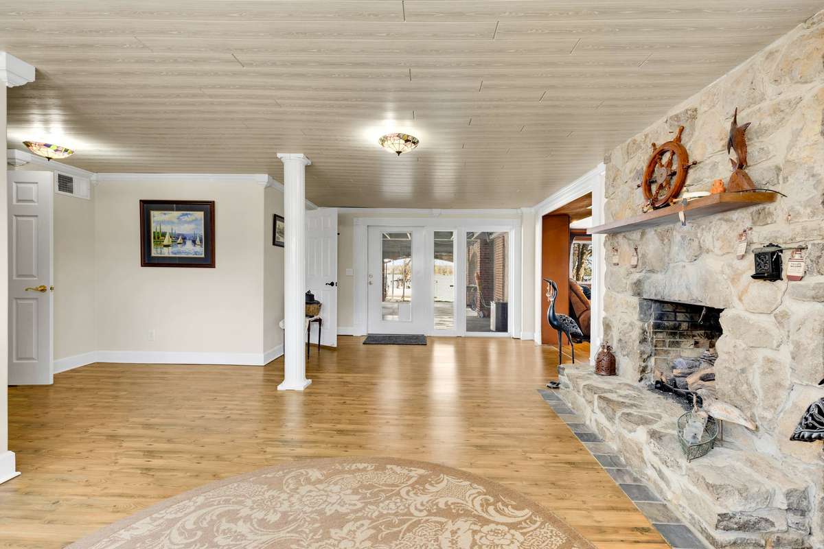 Amazingly cozy family room with stone fireplace