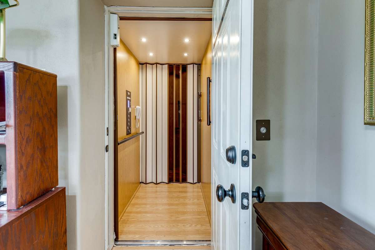 Elevator that has four stops, making the home very accessible and convenient