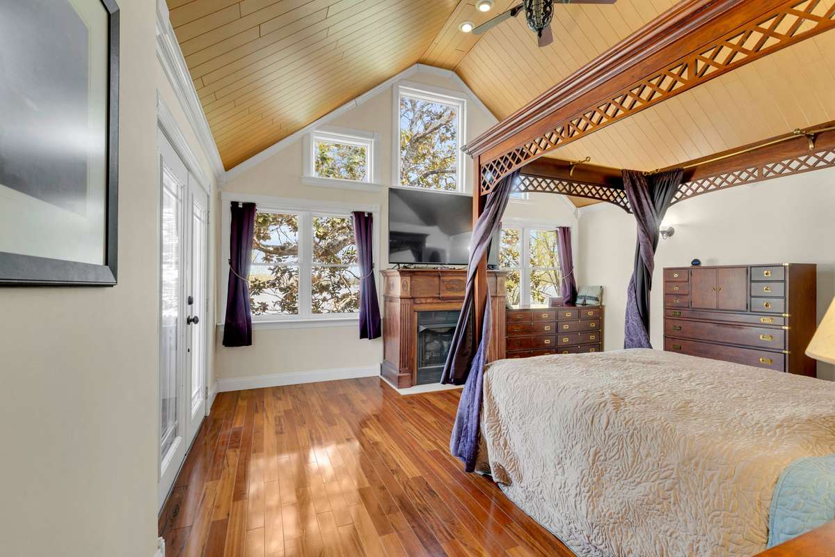 Owner's Suite with Brazilian tiger wood floors, spa-like bath, and a wonderful view of the lake