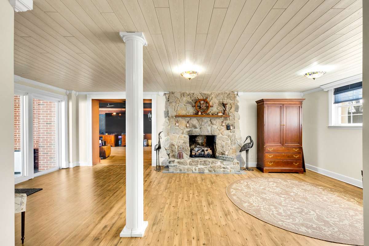Amazingly cozy family room with stone fireplace