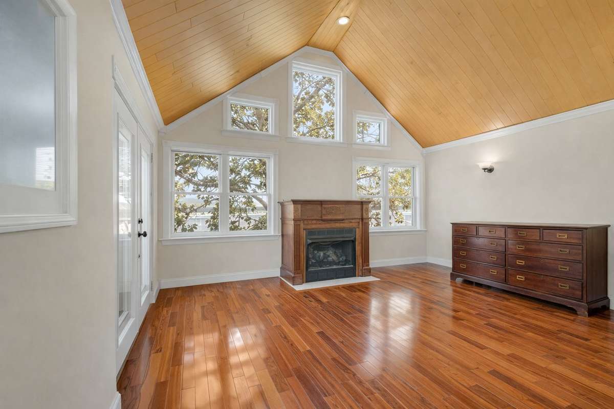 Owner's Suite with Brazilian tiger wood floors, spa-like bath, and a wonderful view of the lake
