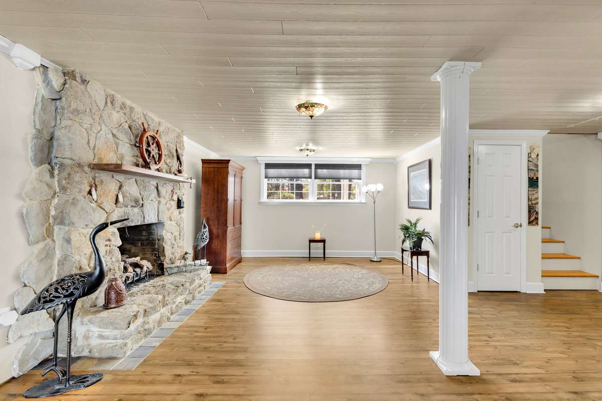 Amazingly cozy family room with stone fireplace