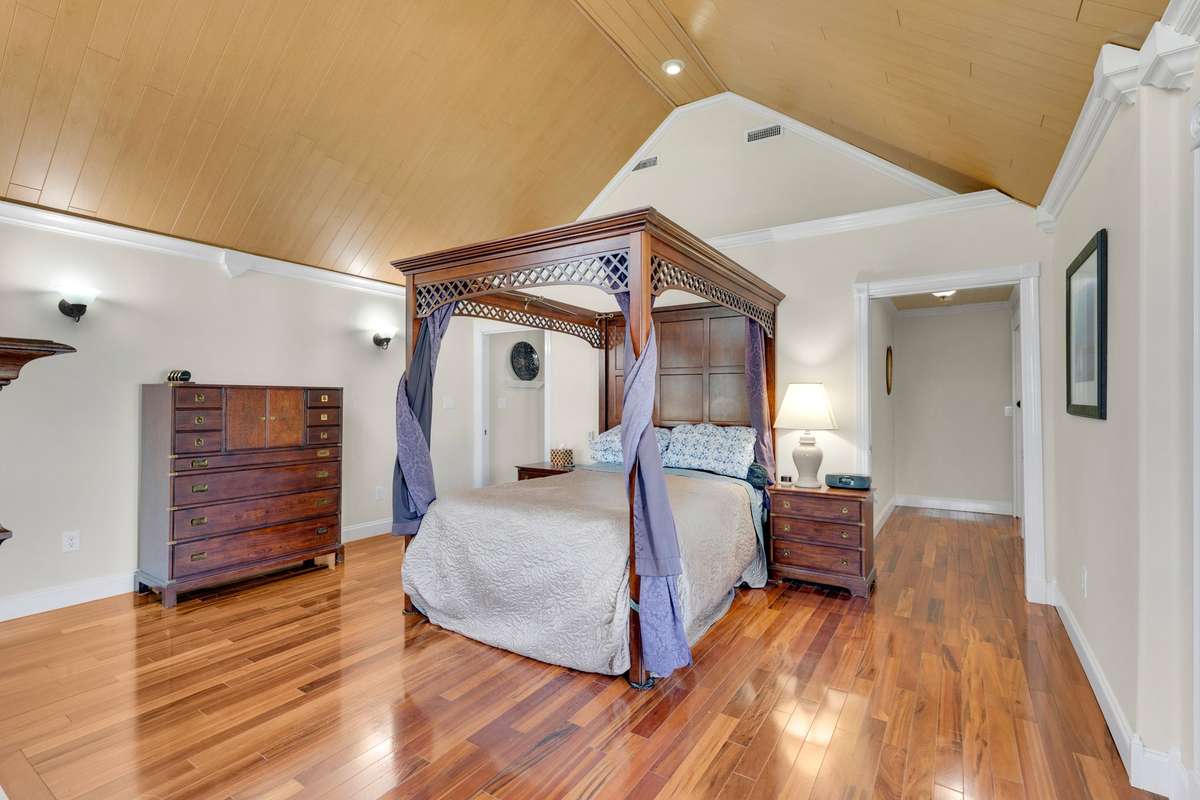 Owner's Suite with Brazilian tiger wood floors, spa-like bath, and a wonderful view of the lake